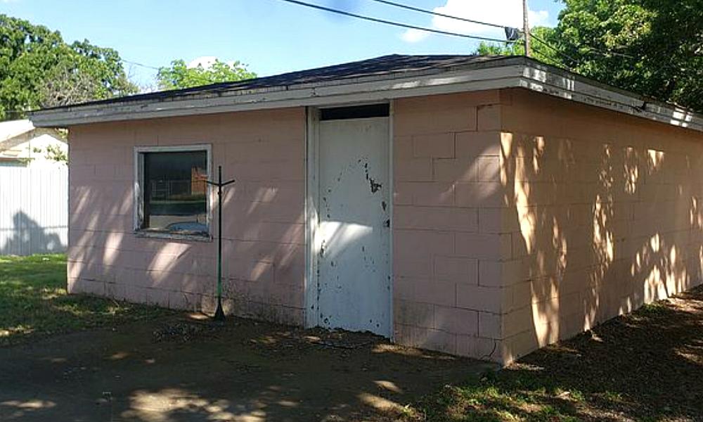 Front of building showing the front door and window