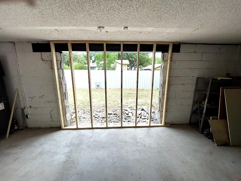 Repositioning the support wall to close the opening