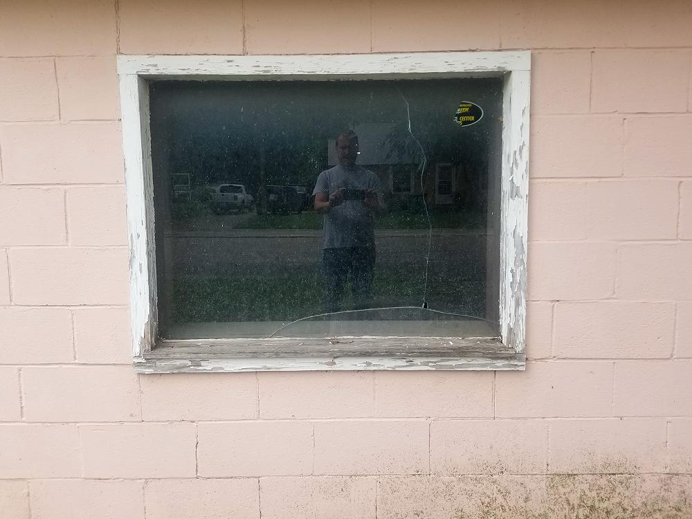 Old broken window needs replaced