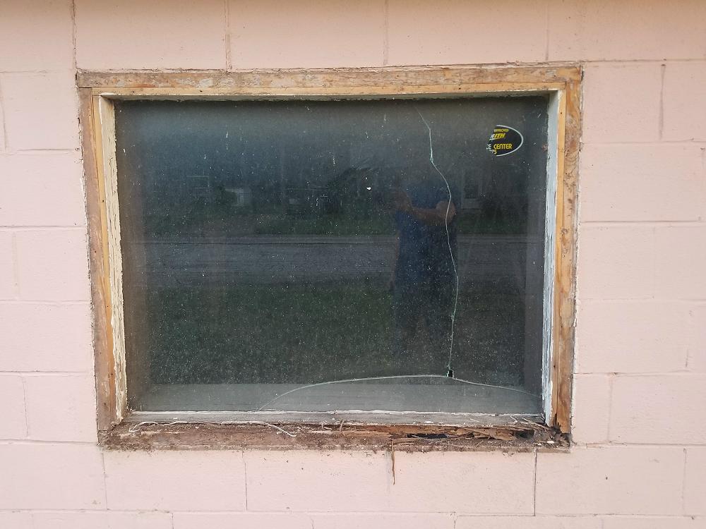 A view of the wood frame after the trim is removed