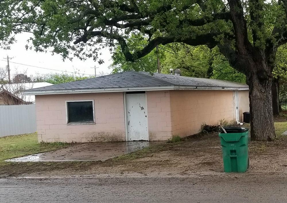 How the building looked before the new window and door